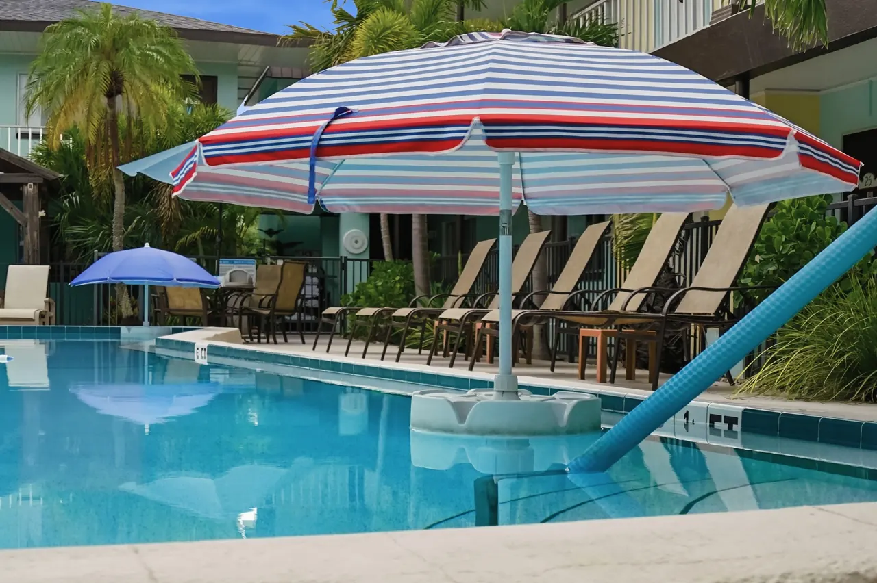 Pool with sunshade and lounge seating